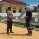Bhabinkamtibmas Desa Daha Pantau Kegiatan Jemur Jagung Warga dalam Rangka Dukung Ketahanan Pangan Nasional