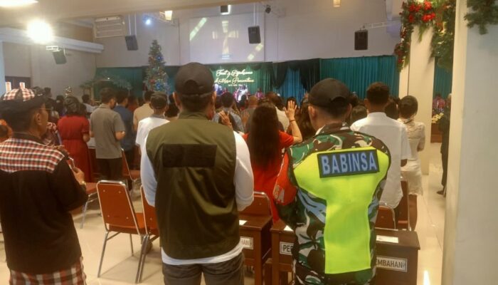 Babinsa, Linmas, dan Pecalang Jaga Natal Damai